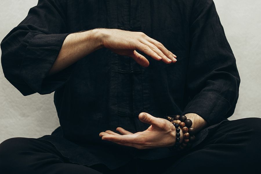 Meditating figure in a Kundalini mudra, symbolizing the physical body