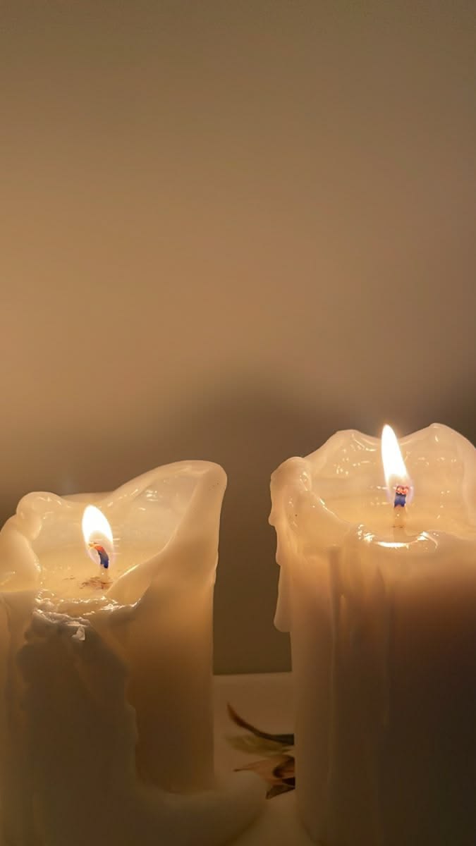 Two softly glowing candles